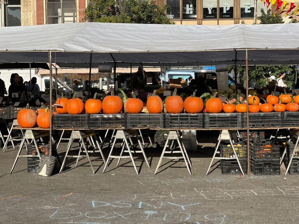 A colorful display of seasonal fruits and vegetables at a local farmers' market