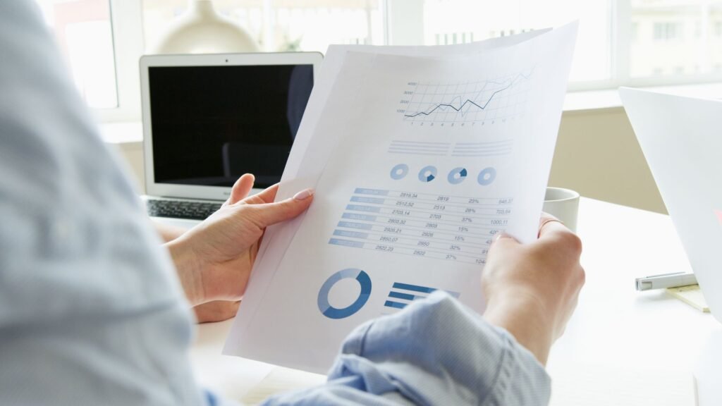 A person carefully reviewing their credit report to ensure accuracy and understand their financial standing