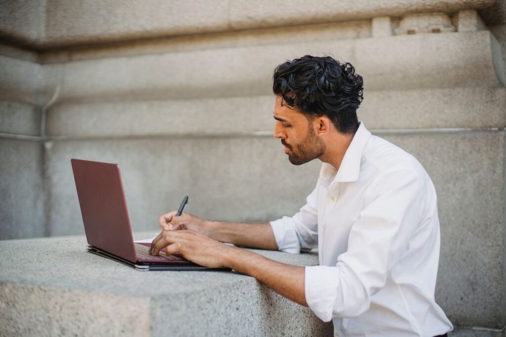 Writer researching a money guide on a laptop