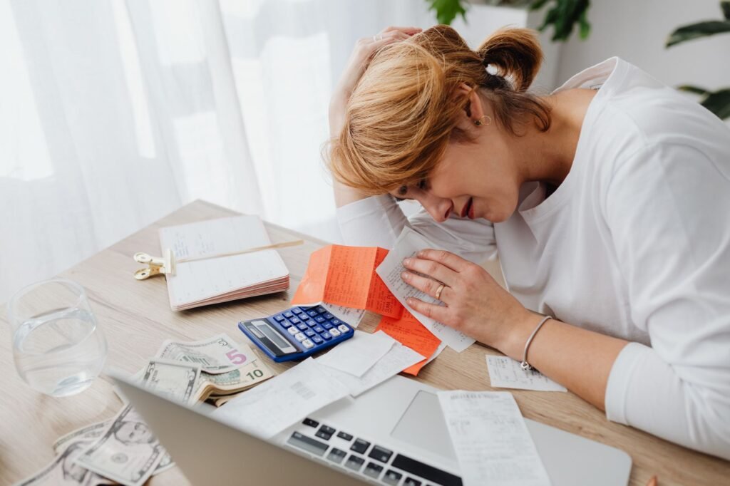 An individual reviews their budget to ensure they are on track with their finances