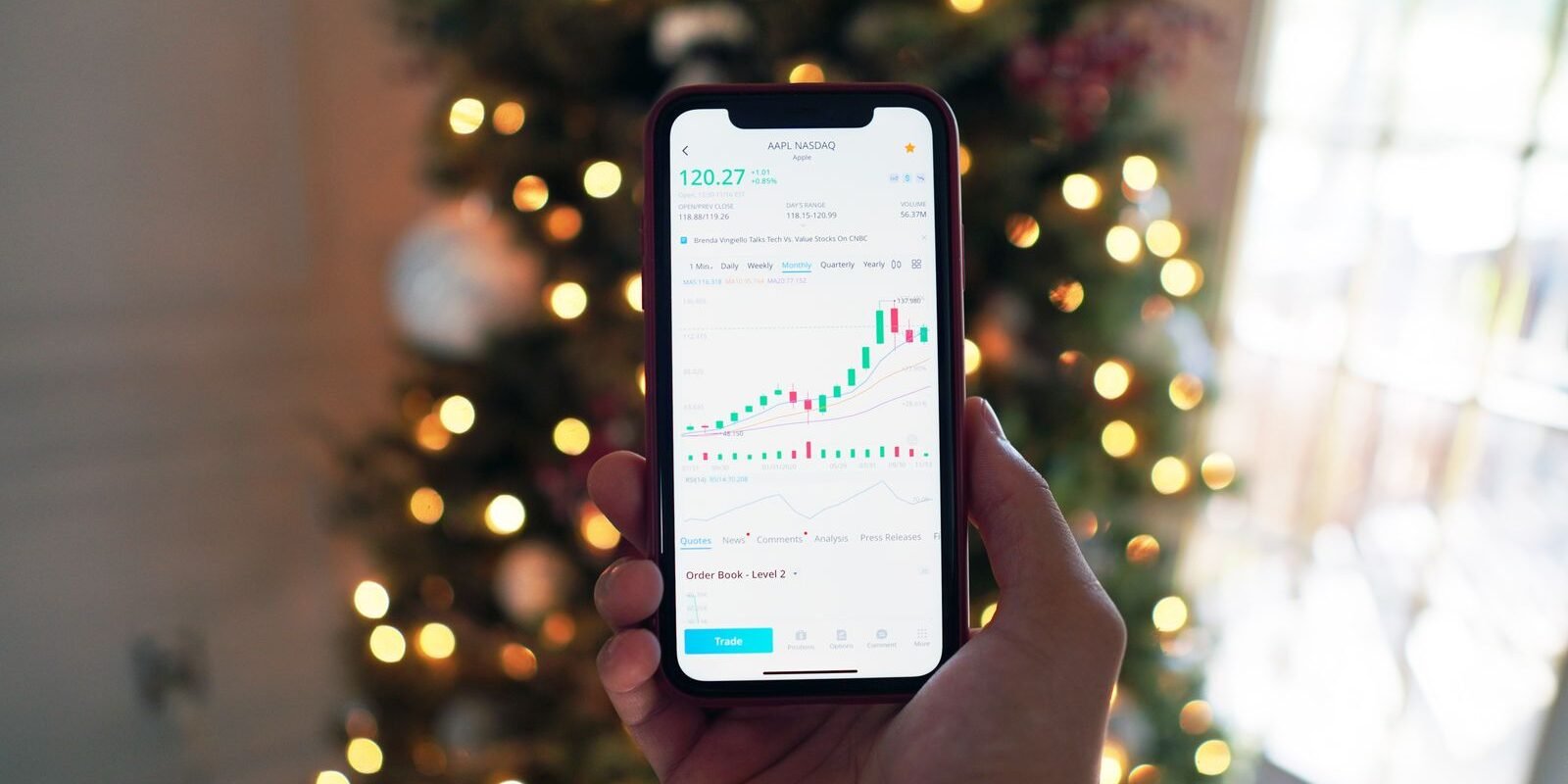 Checking an investing app on a smartphone