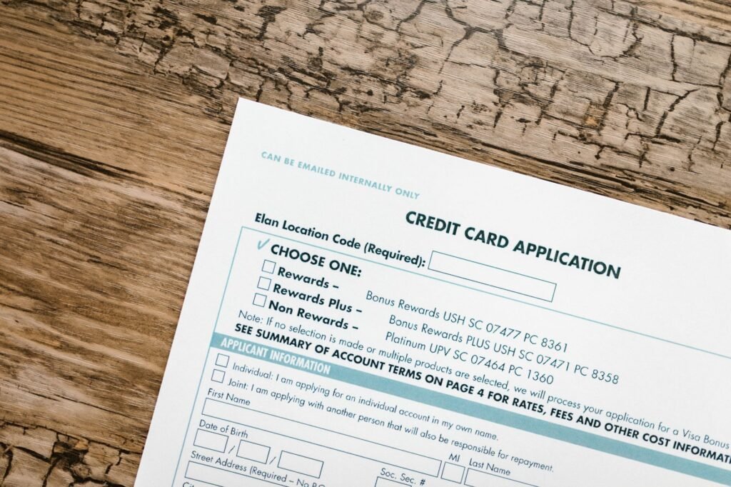 Top view of a credit card application form on rustic wooden background