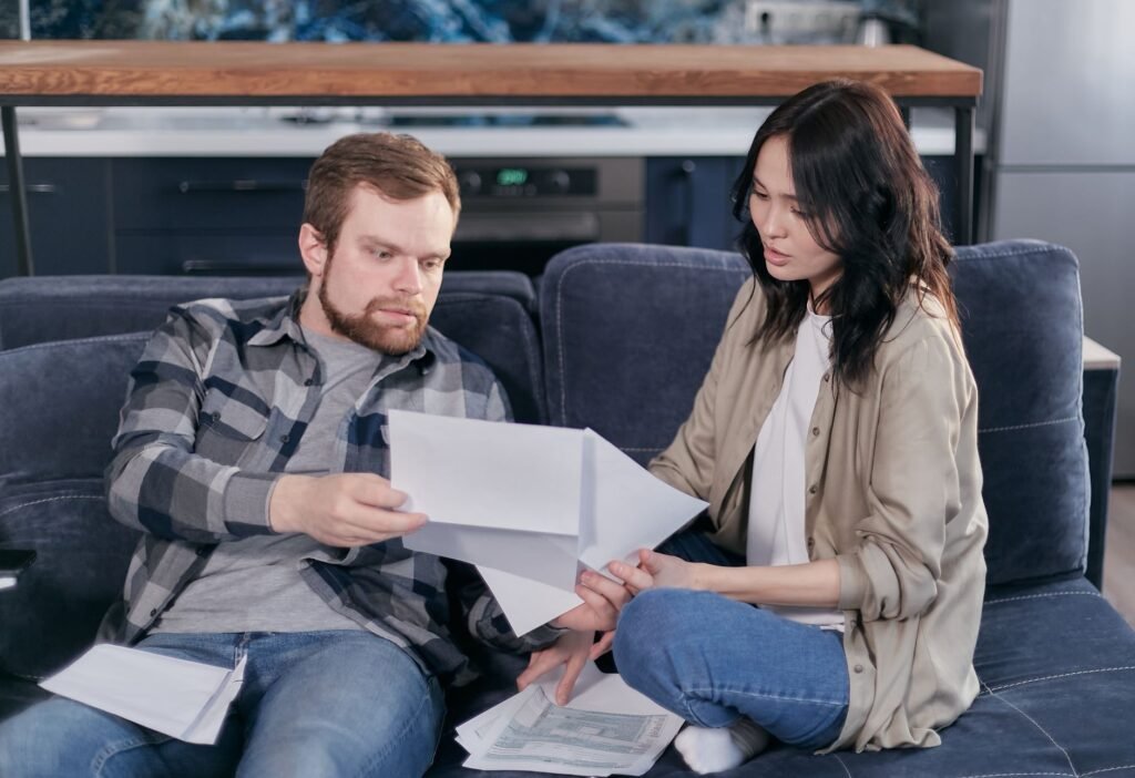 A couple managing their budget and reviewing bills together