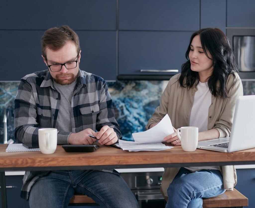 A family discussing their finances and budgeting together