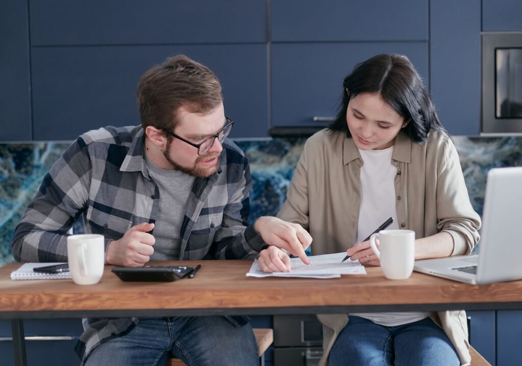 A family reviewing their budget to enhance savings