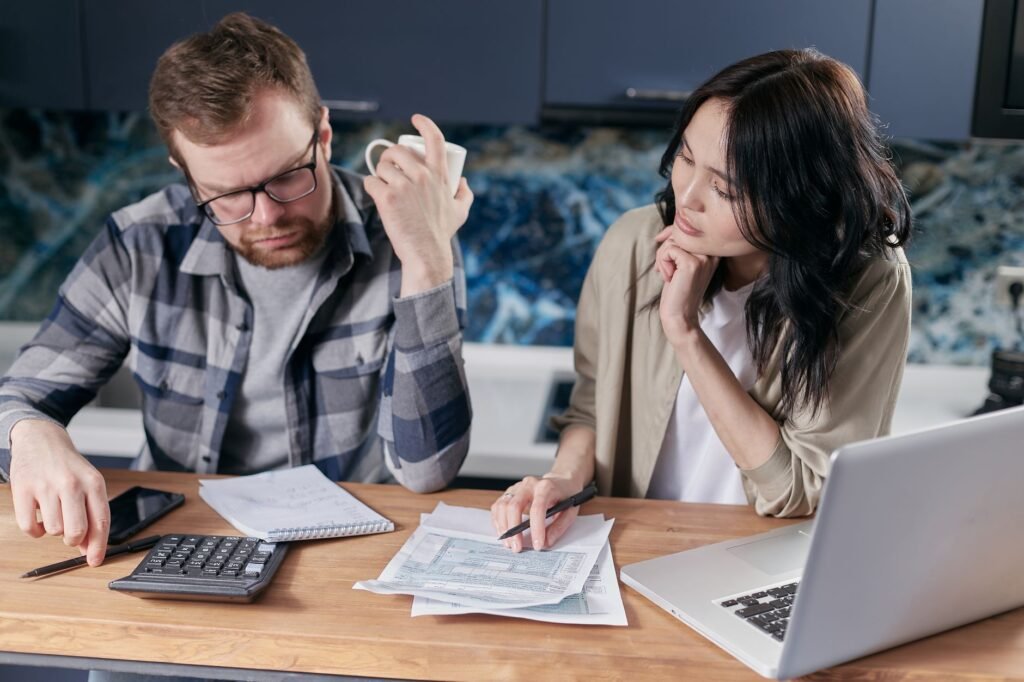A family reviewing their budget to manage housing costs effectively