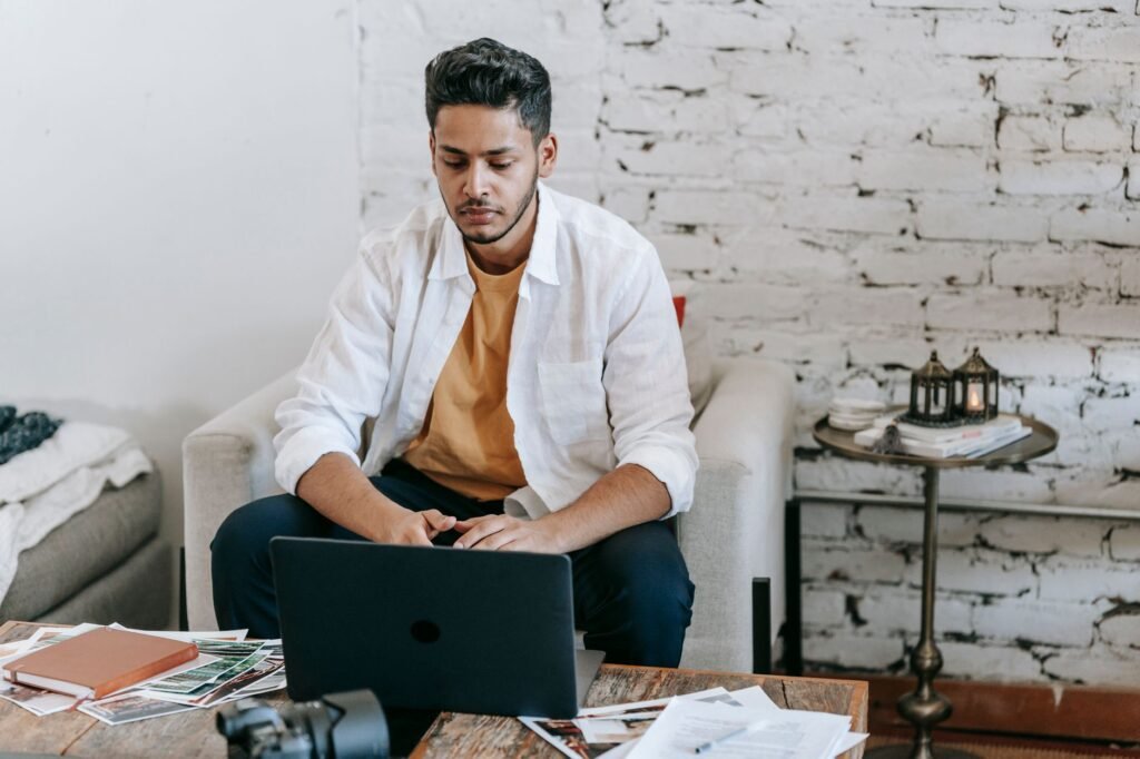 A freelancer working on their laptop, managing finances on the go