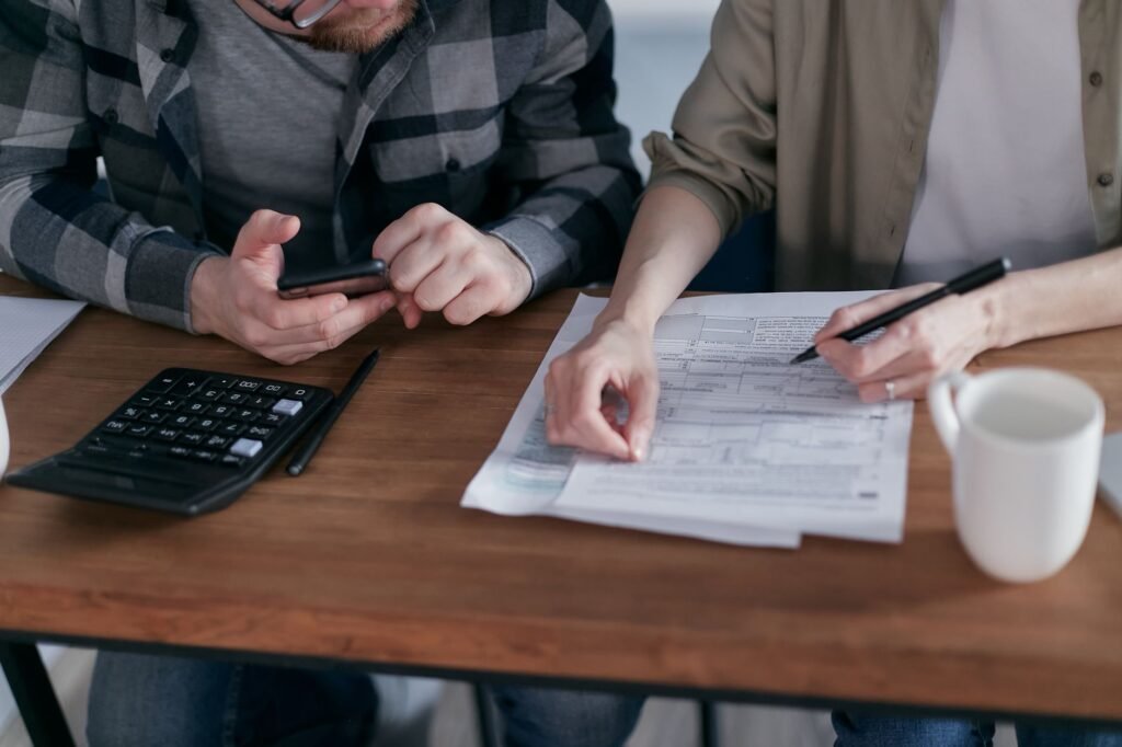 A group of friends discussing finances and budgeting together