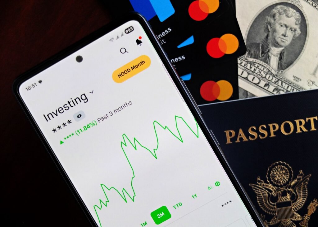 A person engaging with an investment app on a smartphone