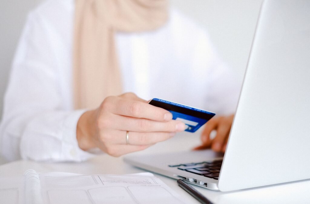 A person managing their checking account online using a laptop