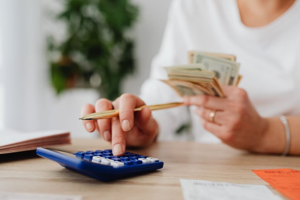A person sitting at a desk creating a budget plan