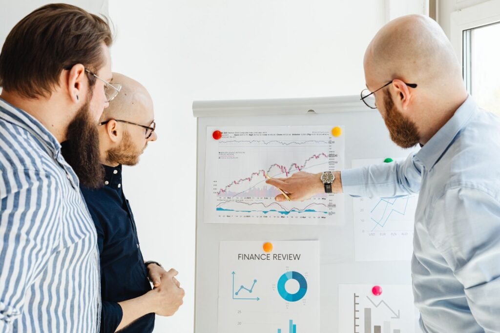 Business team reviewing financial charts during a strategy meeting indoors