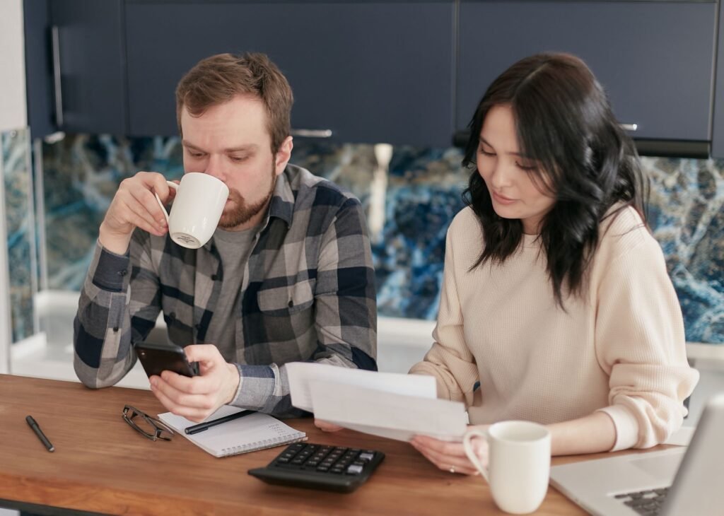 Couple discussing their monthly expenses together